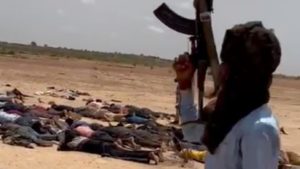 RSF guard unarmed black African men lying face down on the outskirts of Geneina, Darfur, June 2023